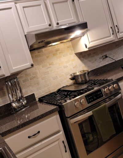 A kitchen with stainless steel appliances.